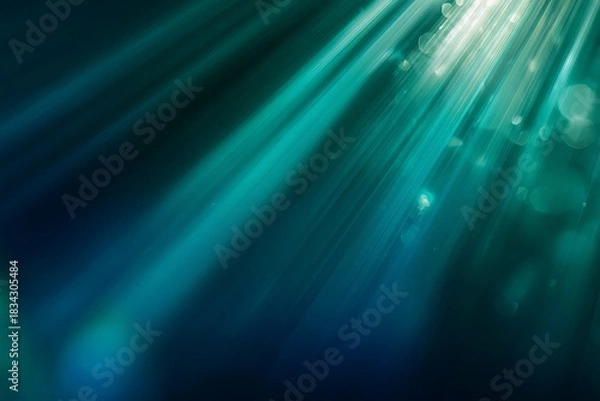 Obraz Intense illumination streams through deep turquoise water creating ethereal light rays