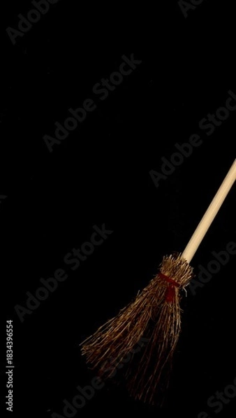 Obraz Mini witch brooms on black background, occult props, mystical composition, esoteric tools for magic and rituals