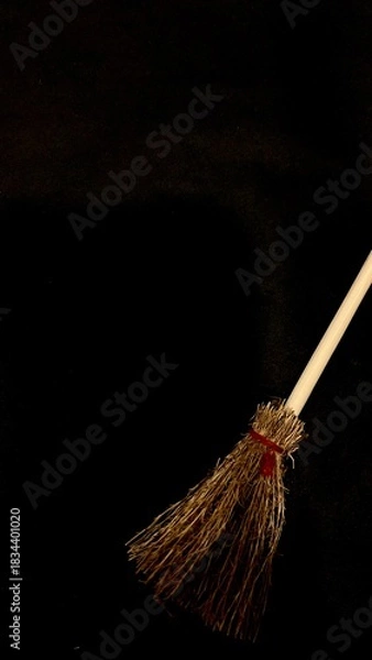 Obraz Mini witch brooms on black background, occult props, mystical composition, esoteric tools for magic and rituals