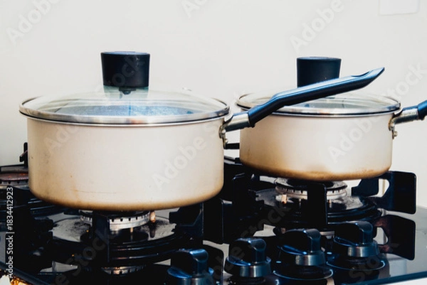 Obraz Two gray pots on a stove, close up
