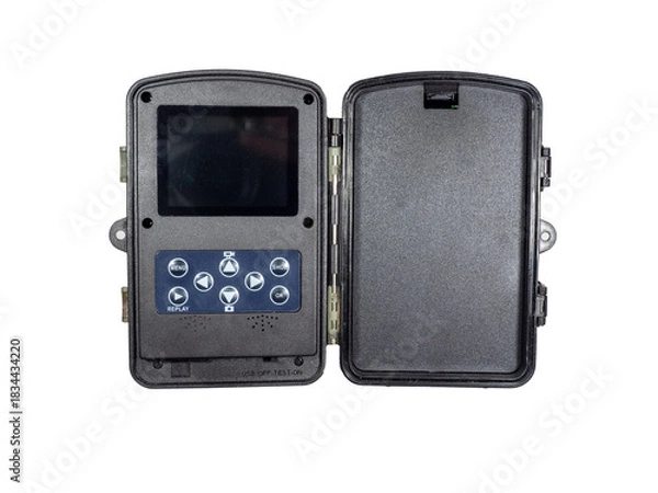 Fototapeta Programming and setting up a hunters camera. Animal trail photo trap in an open way. Video and photo capabilities with a wildlife camera