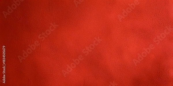 Fototapeta A close-up, full-frame shot of a solid red textured background with subtle wrinkles and soft lighting.