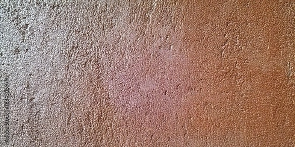 Fototapeta Close-up view of a textured, rough, and weathered reddish-brown wall surface.