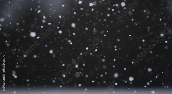 Obraz Gentle snowfall against a dark moody background