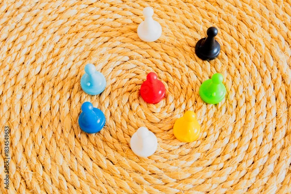 Obraz Concept of leadership, a red pawn entering a circle formed by colorful pawns