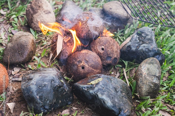 Obraz Coconut Husk Fire Surrounded by Rocks