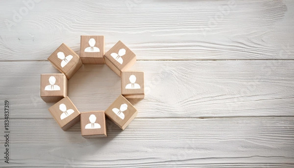 Obraz Wooden Blocks with Human Icons Arranged in Circular Shape on White Rustic Wooden Tabletop