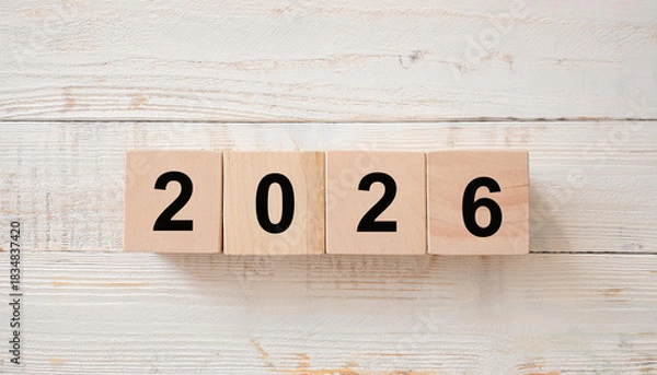 Obraz Top View of Wooden Blocks with Black Numbers Arranged Horizontally to Read 2026 on Light Wood