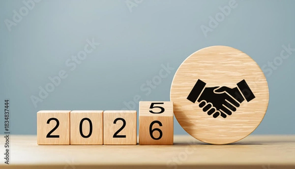 Obraz Business Handshake Icon on Wooden Circle with Year Shift from 2025 to 2026 Blocks