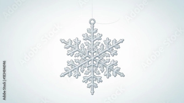 Fototapeta A single detailed crystalline snowflake ornament hangs suspended by a thin thread against a soft gradient light blue background representing winter