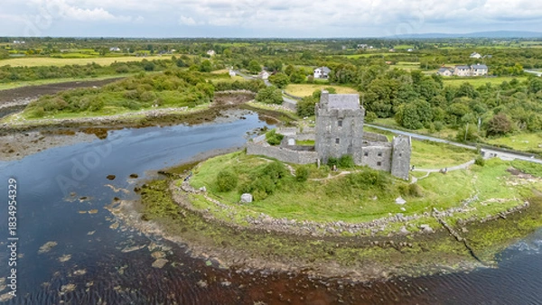 Fototapeta Aerial drone view of Dunguaire Castle, a 16th century tower house top view from above, historical castle in Galway Bay, Ireland
