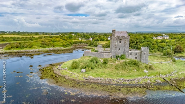 Fototapeta Aerial drone view of Dunguaire Castle, a 16th century tower house top view from above, historical castle in Galway Bay, Ireland