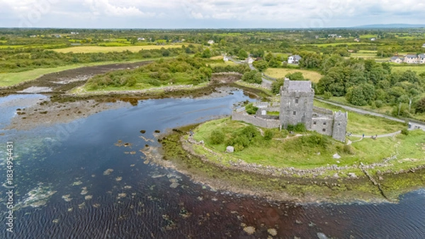 Fototapeta Aerial drone view of Dunguaire Castle, a 16th century tower house top view from above, historical castle in Galway Bay, Ireland