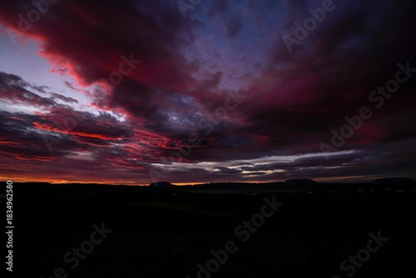 Obraz Sunrise scenery over lake Myvatn with mountains and clouds in the sky - Iceland