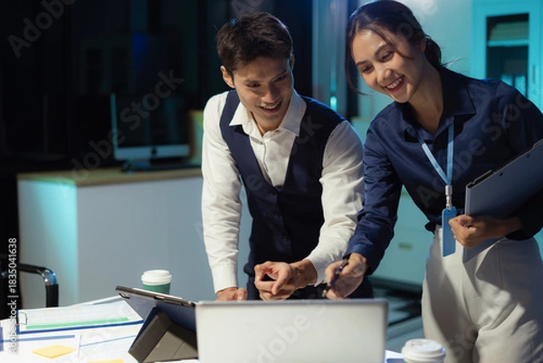 Obraz Business team analyzing financial data and planning projects in modern office.