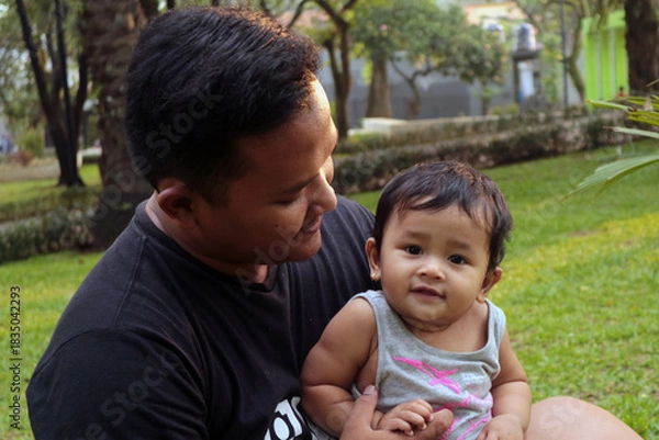 Obraz Happy Dad and Toddler Bonding Outdoors