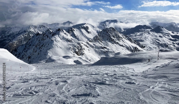Fototapeta Beautiful view on snowy mountain range and ski slope in Austria Alps, Obertauern at winter