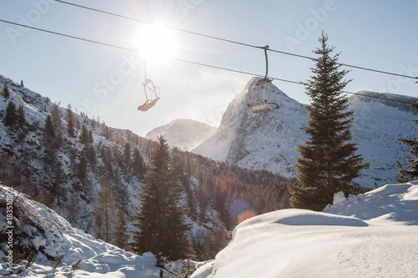 Obraz chair lifts with snow-capped dolomites in the background