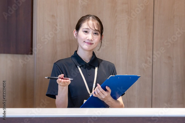 Obraz 受付の女性