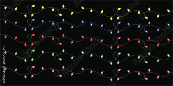 Fototapeta Strings of yellow blue red green and pink christmas lights on a black background decoration art