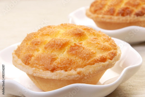 Fototapeta Coconut custard tarts  on white plate