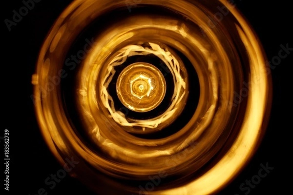 Fototapeta Abstract view of a light reflecting on surrounding glass