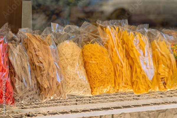 Fototapeta Various Shape and Size of Italian Style Pasta in Bags at Shelf