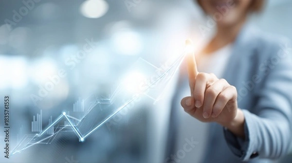 Obraz 成長を示すグラフに触れるビジネス女性