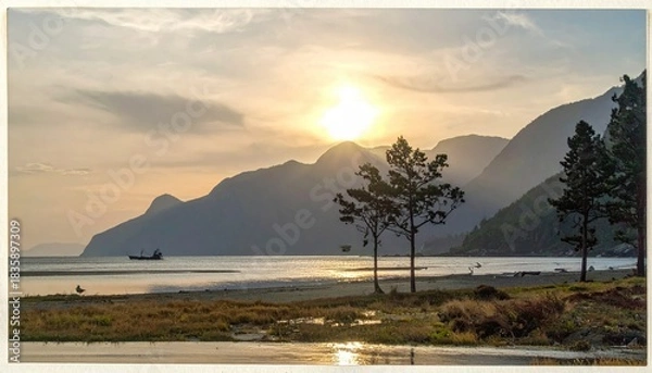 Obraz Sunset over mountain-lined coastline
