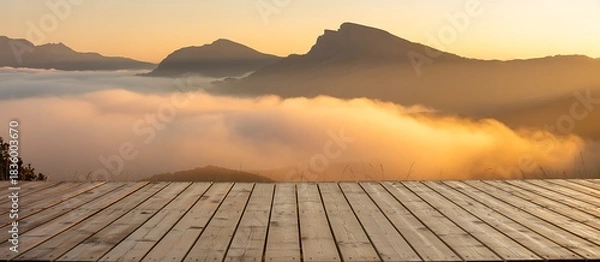 Obraz Wooden deck overlooks mist filled mountains.