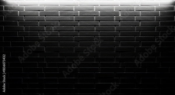 Fototapeta Dark brick wall illuminated by a soft light creating a textured background for architectural and design projects showcasing modern industrial aesthetics and minimalist style