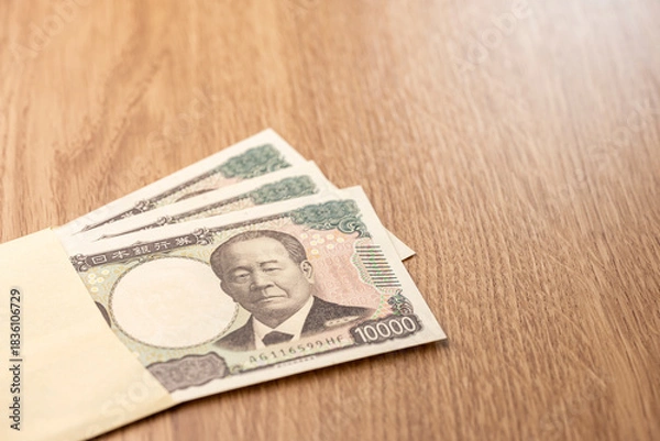 Obraz 封筒から広がる日本円一万円札と資金のコンセプト