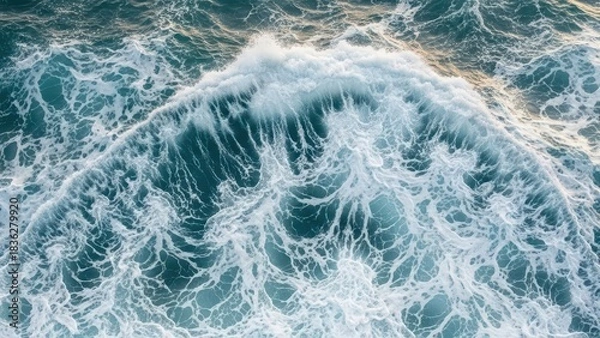 Fototapeta Dynamic Ocean Waves Crashing and Foaming in a Vibrant Blue Sea.