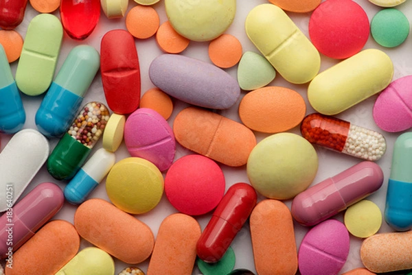 Fototapeta Multicolored tablets on white background