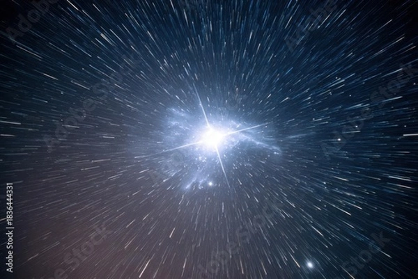 Obraz Dynamic star trails creating a cosmic light speed explosion.