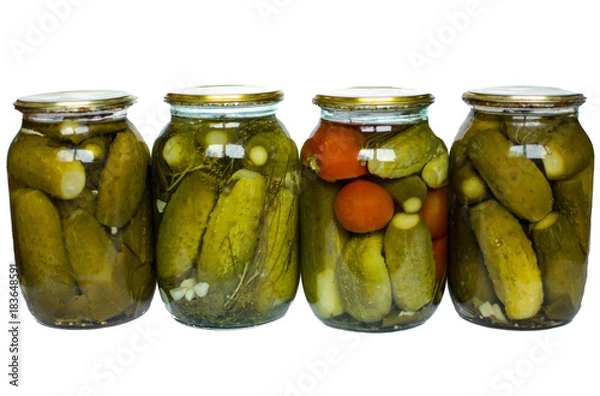Fototapeta Pickled tomatoes and cucumbers in glass jars isolated on white background