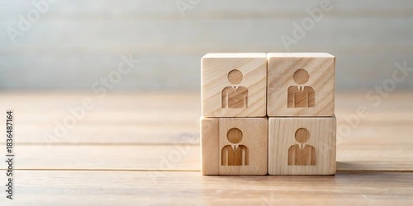 Fototapeta Four Wooden Blocks Stacked Depicting Human Figures Symbolizing Teamwork and Business Structure Standing on a Wooden Surface Against a Blurred Wooden Wall Background