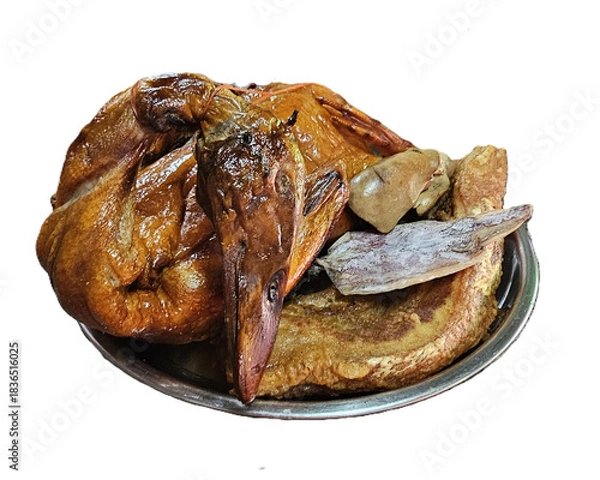 Fototapeta Isolated studio image of traditional Chinese New Year offerings featuring a whole roasted duck, sliced roasted pork, and dried squid for ancestral worship and festive ritual use.