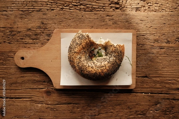 Obraz bitten bagel on a table