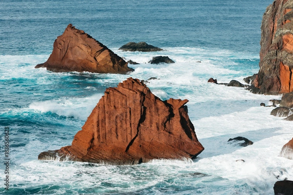 Obraz Majestic rocky coastline with rugged cliffs and vibrant turquoise waves crashing against the shore, showcasing the beauty of nature and coastal landscapes