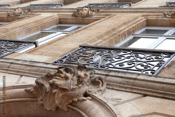 Obraz Facade statuettes called mascarons on classical architecture