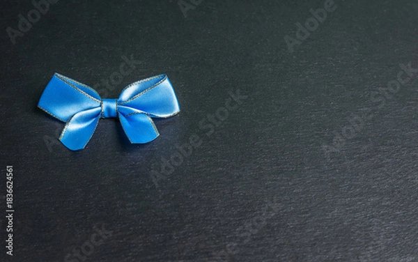 Obraz blu bow on black background