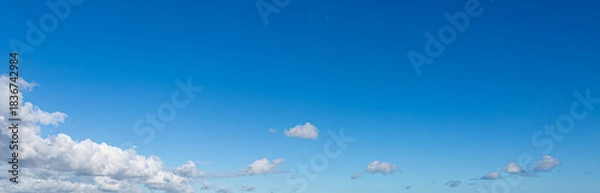 Obraz Deep Blue Sky with White Clouds, background.