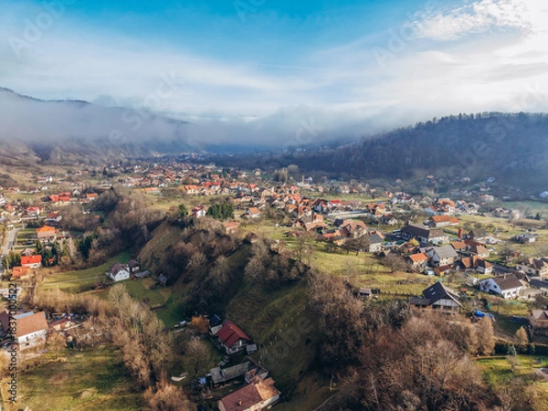 Fototapeta Aerial View of Moeciu de Jos Village in the Carpathian Mountains, Romania