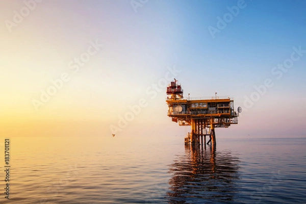 Obraz Sunset time,Offshore construction platform for production oil and gas, Oil and gas industry and hard work, Production platform and operation process by manual and auto function