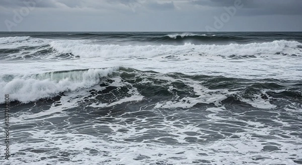 Fototapeta Dramatic Ocean Waves Crashing Under a Cloudy Sky.