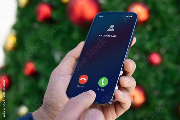 Obraz man hands  hold phone with incoming call on screen