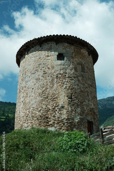 Fototapeta View of a medieval tower in a mountain village Bandujo