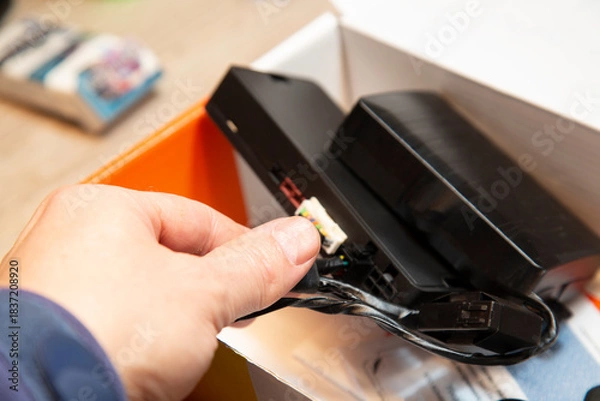 Fototapeta Car alarm installation. Security system with remote start.