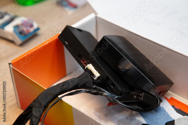 Fototapeta Car alarm installation. Security system with remote start.